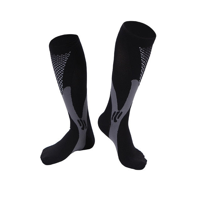 Relisora AMS knee-high compression socks, hero angle, showing graduated 20–30 mmHg knit designed to support circulation for sport, travel, and long workdays.