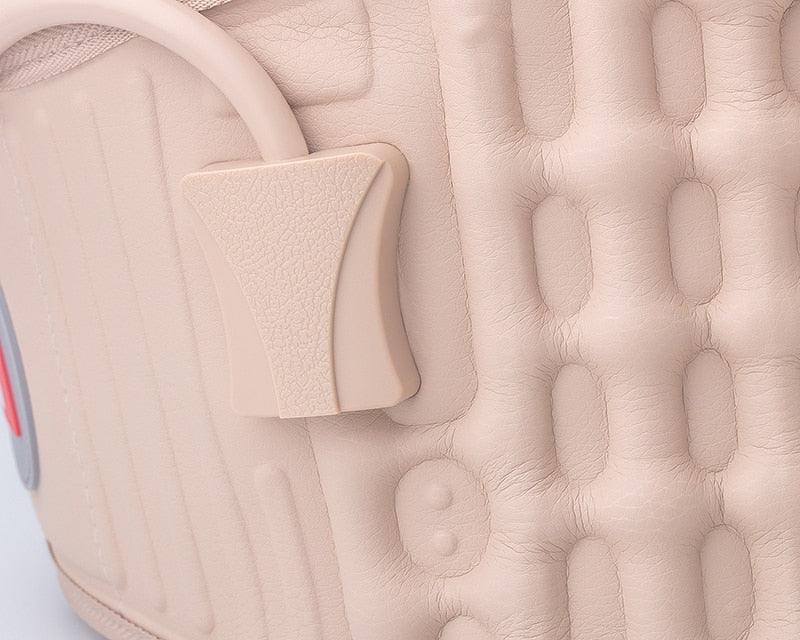 Close-up of a beige textured surface with a small rectangular pad.