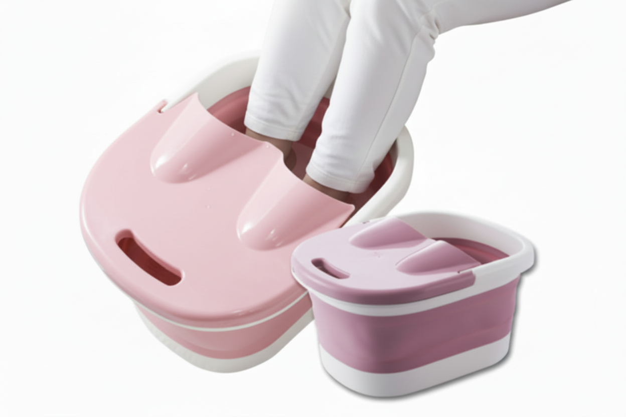 Foot bath with pink basin and blue footrest on a white background