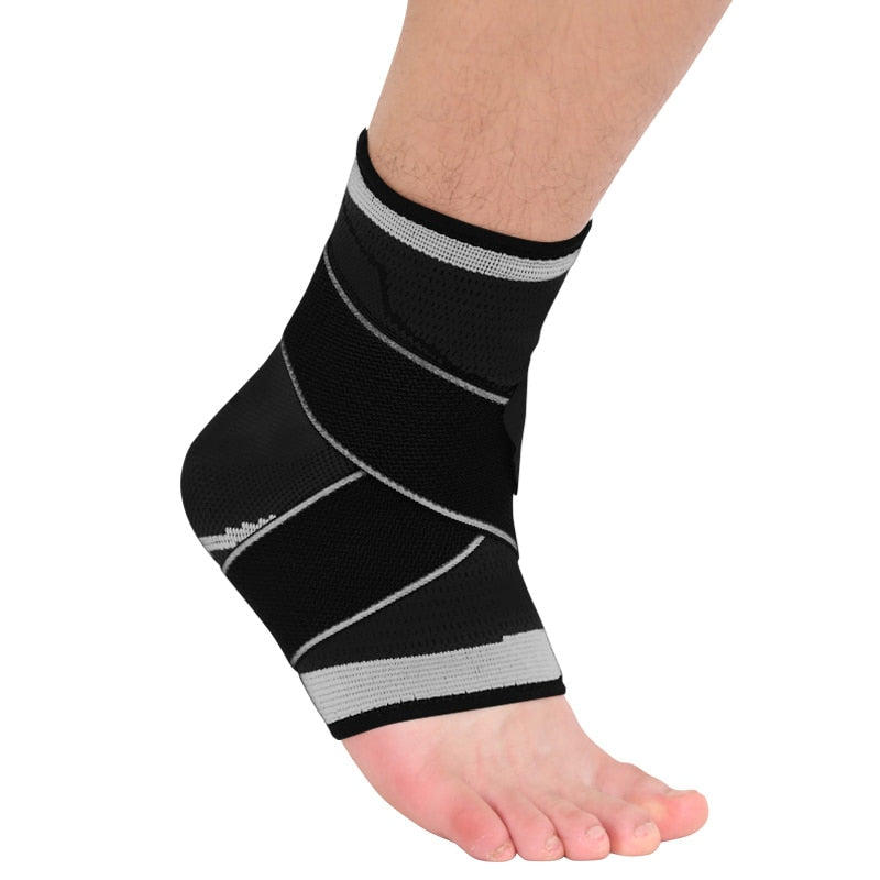 Black ankle support brace on a foot against a white background