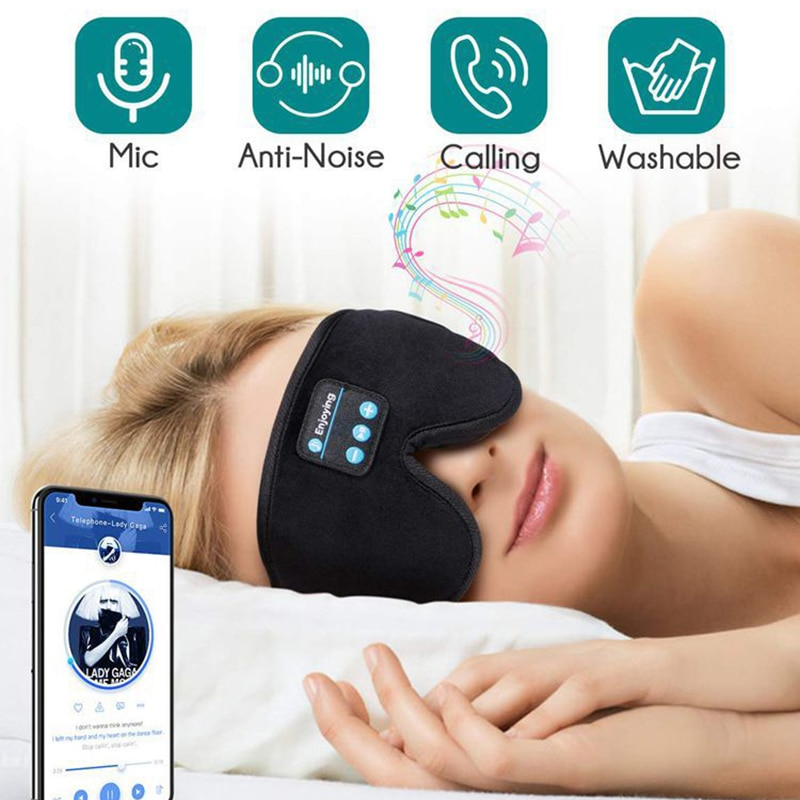 Person wearing a black sleep mask with smartphone app interface, icons for mic, anti-noise, calling, and washable features.