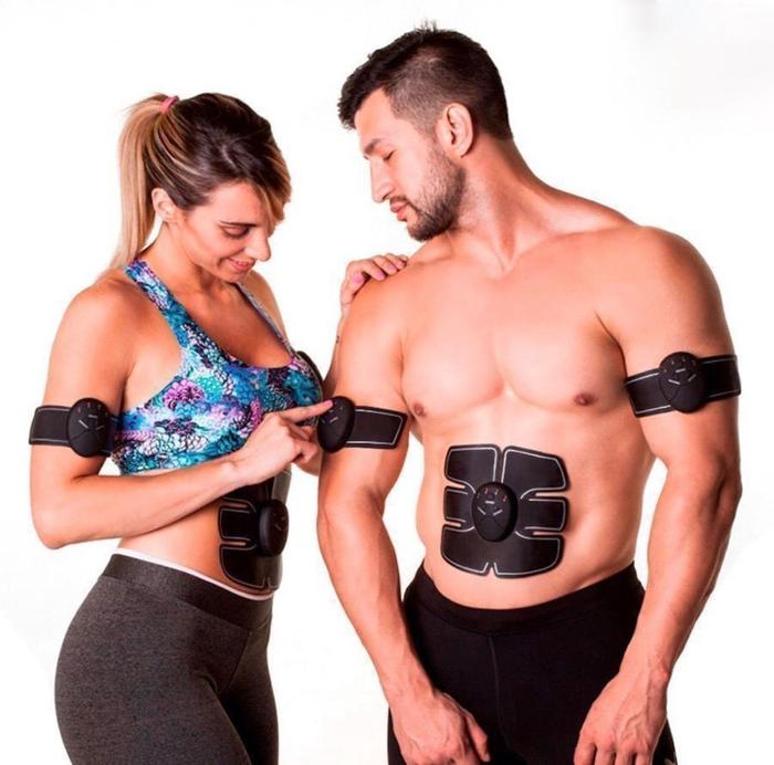 EMS muscle stimulator kit front view showing abs pad, two arm pads, and hip trainer with wireless controller, designed to help support core and glute activation.