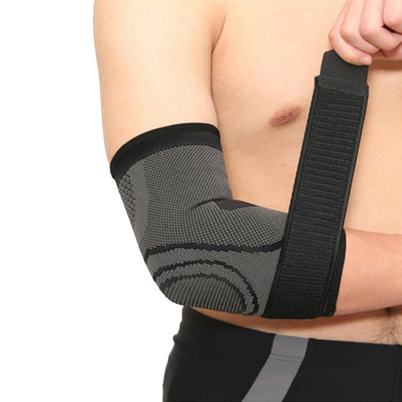 Relisora Person wearing a black and gray elbow support brace on a white background