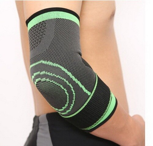 Gray and green elbow brace on a person's arm against a white background
