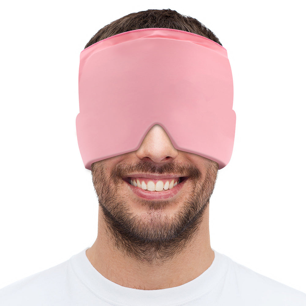 Man wearing a pink sleep mask on a white background