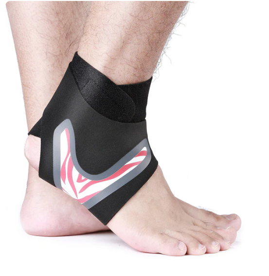 Black ankle support brace on a person's ankle with a white background