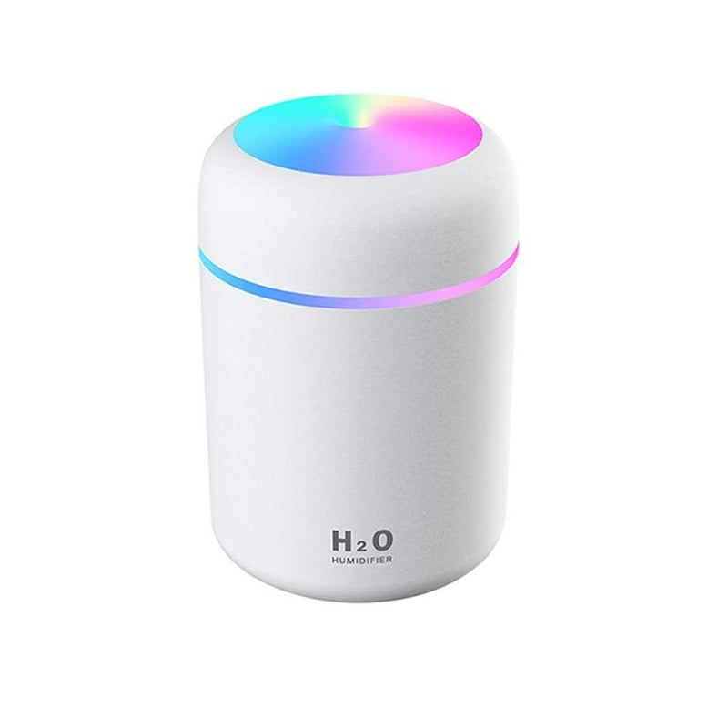 White humidifier with colorful LED lights on a white background