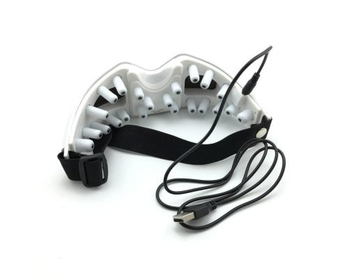 White dental device with black strap and cable on a white background