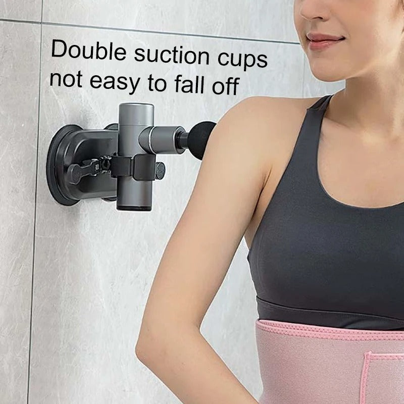 Woman wearing a pink waist trainer with a double suction cup device attached to a wall.