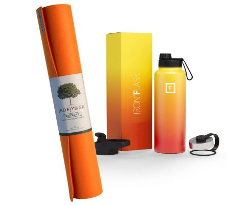 Orange yoga mat, yellow box, and gradient water bottle with black cap on a white background