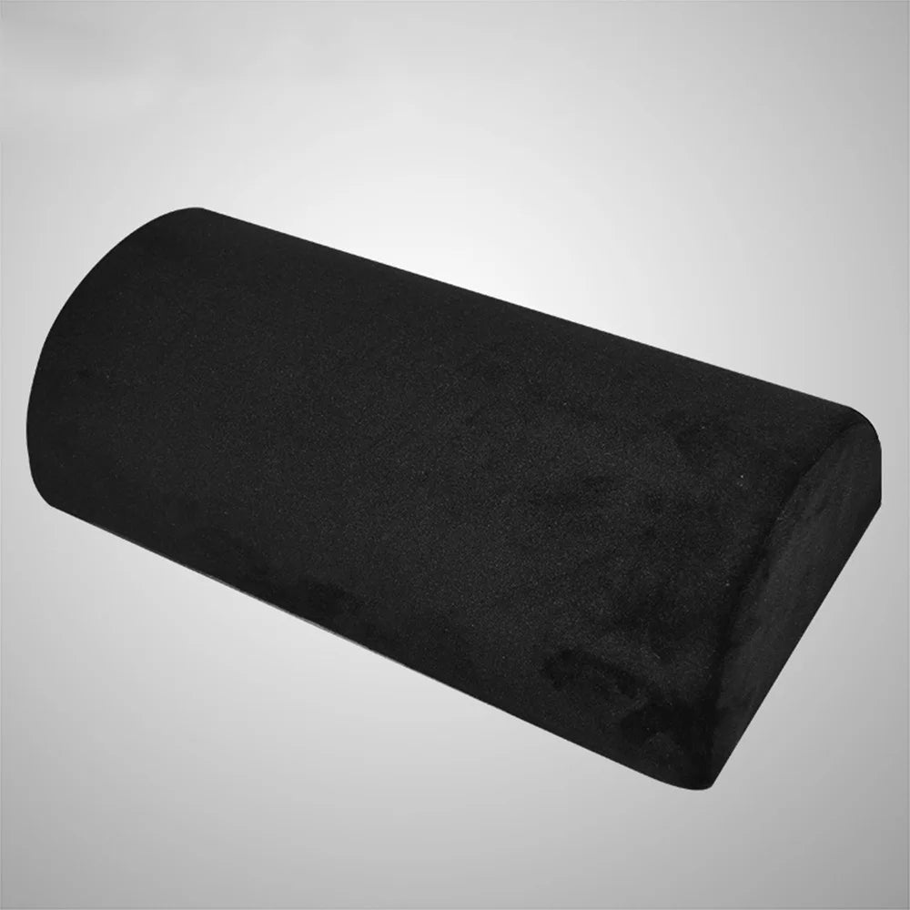 Memory foam under-desk foot rest in teardrop shape shown from front angle with plush cover to support feet and legs.